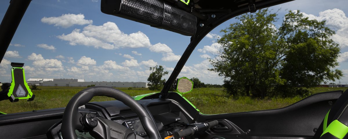 Kawasaki UTV cockpit with overhead KICKER audio