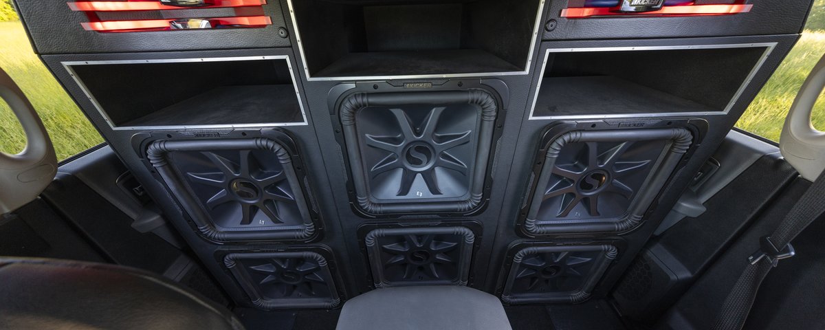 Ram rear-cabin KICKER audio installation with red lighting