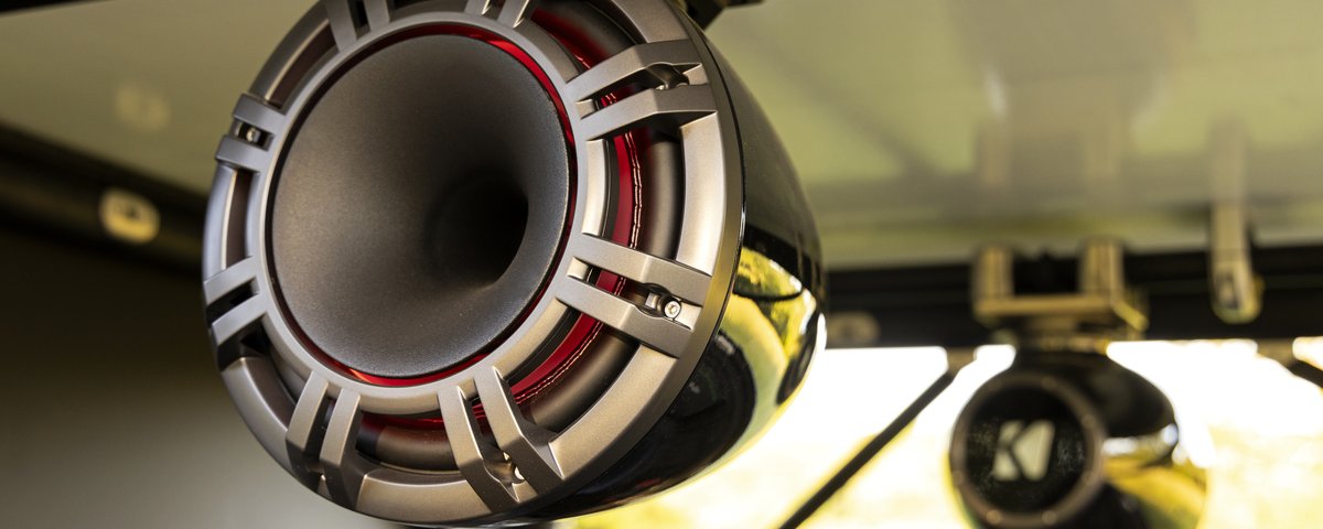 Close view of a KICKER speaker in the Ram truck bed
