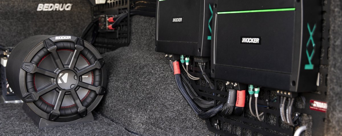 KICKER amplifiers and subwoofer installed in the Ram bed
