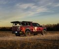 GMC Sierra rear three-quarter view at sunset