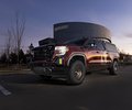 GMC Sierra front three-quarter view outside KICKER headquarters