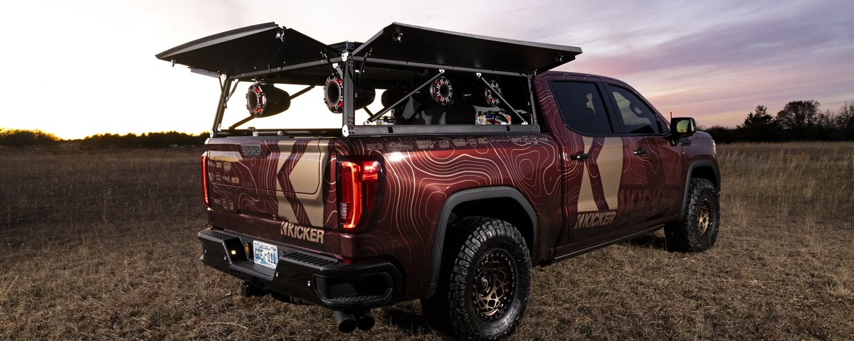 GMC Sierra rear three-quarter view with audio system raised
