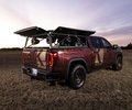 GMC Sierra rear three-quarter view with audio system raised