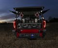 GMC Sierra rear audio system illuminated at dusk
