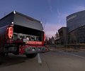 GMC Sierra rear view with the truck-bed audio system open