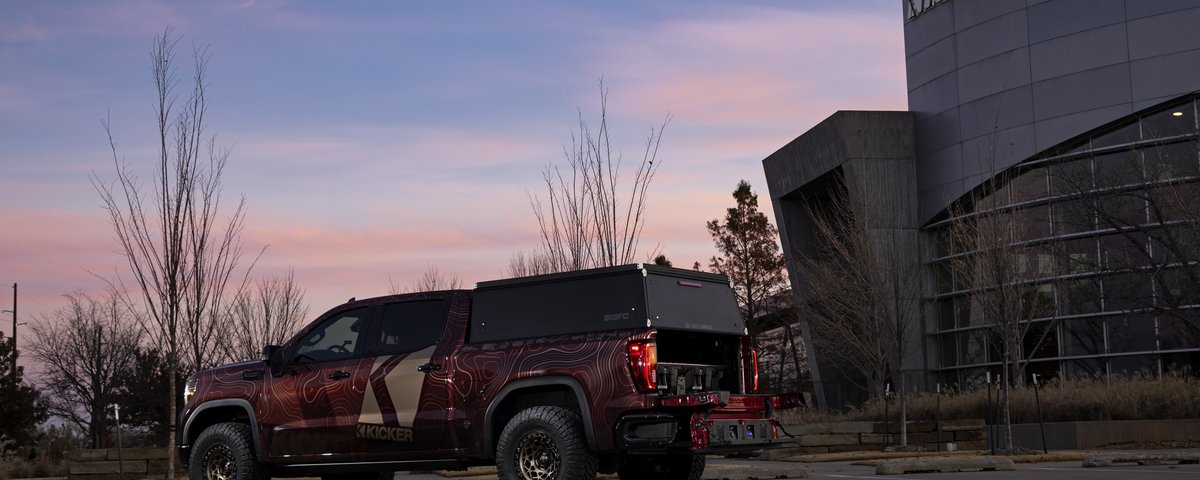 GMC Sierra side profile outside KICKER headquarters
