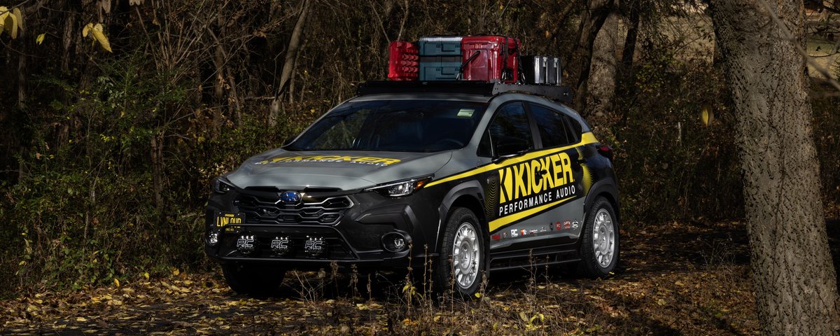 Subaru CrossTrek front three-quarter view in the woods