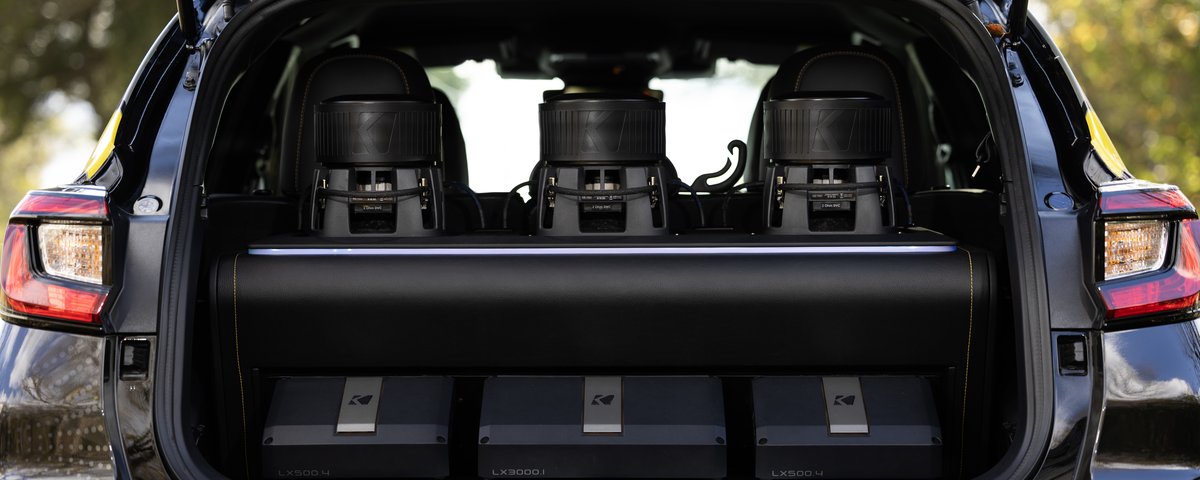 Open Subaru CrossTrek cargo area with custom KICKER audio system