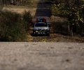Subaru CrossTrek on a wooded trail