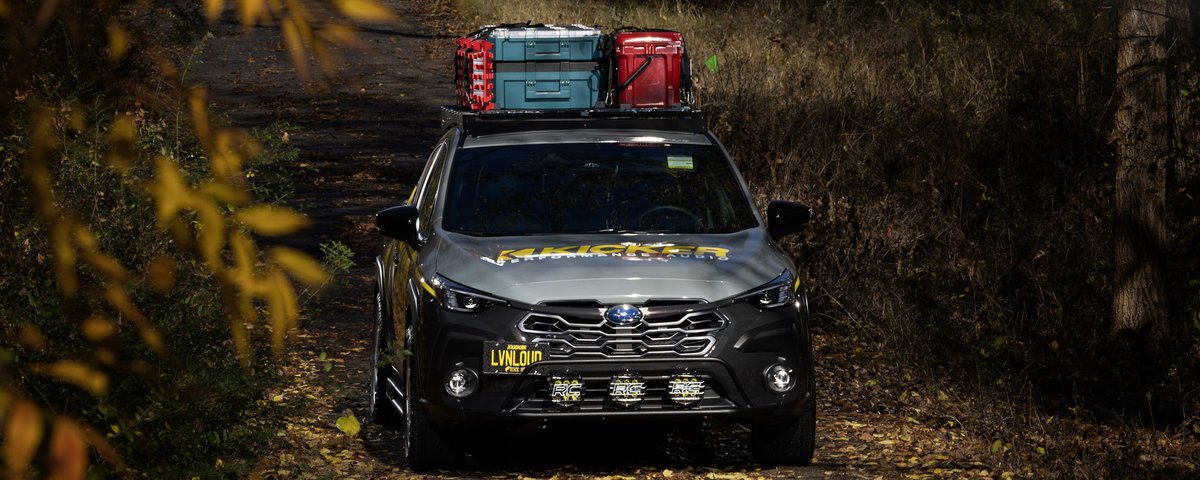 Subaru CrossTrek viewed through autumn foliage