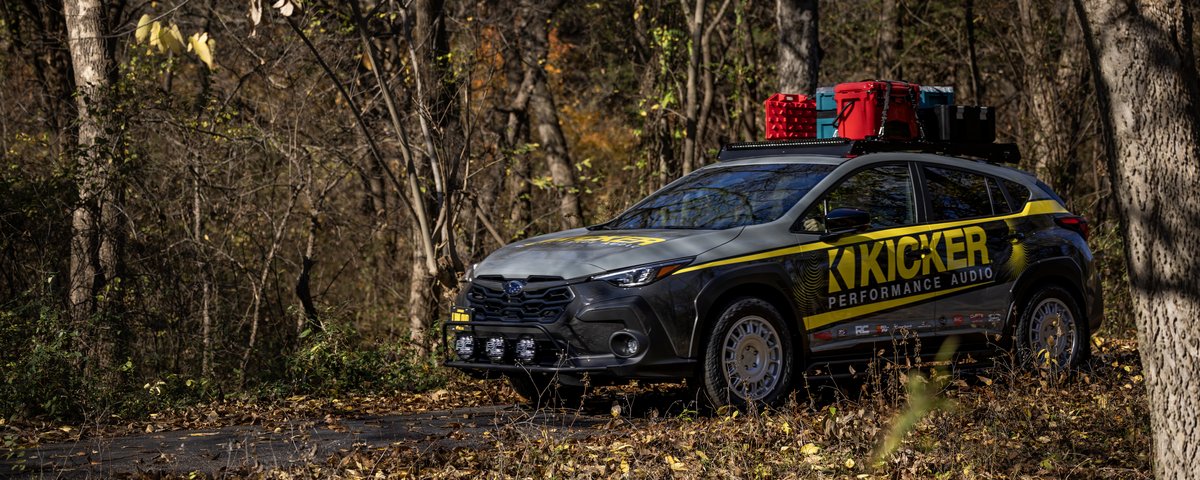 Subaru CrossTrek front-side profile in the woods